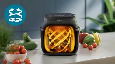 Philips Airfryer with hot air circulating around the food inside the basket